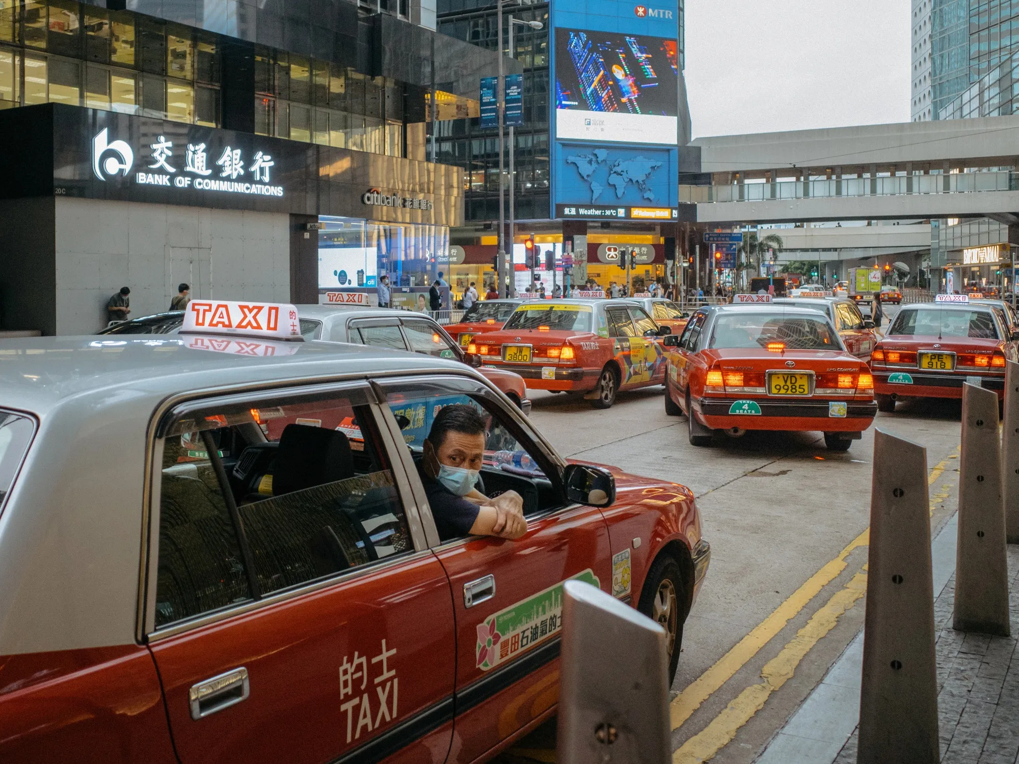 Hong Kong’s iconic red taxis are a common sight on the busy streets of the financial district.