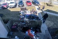 Items are removed from a home during an eviction in Ohio. Advocates are calling to extend the U.S. eviction moratorium as Covid-19 spreads. 