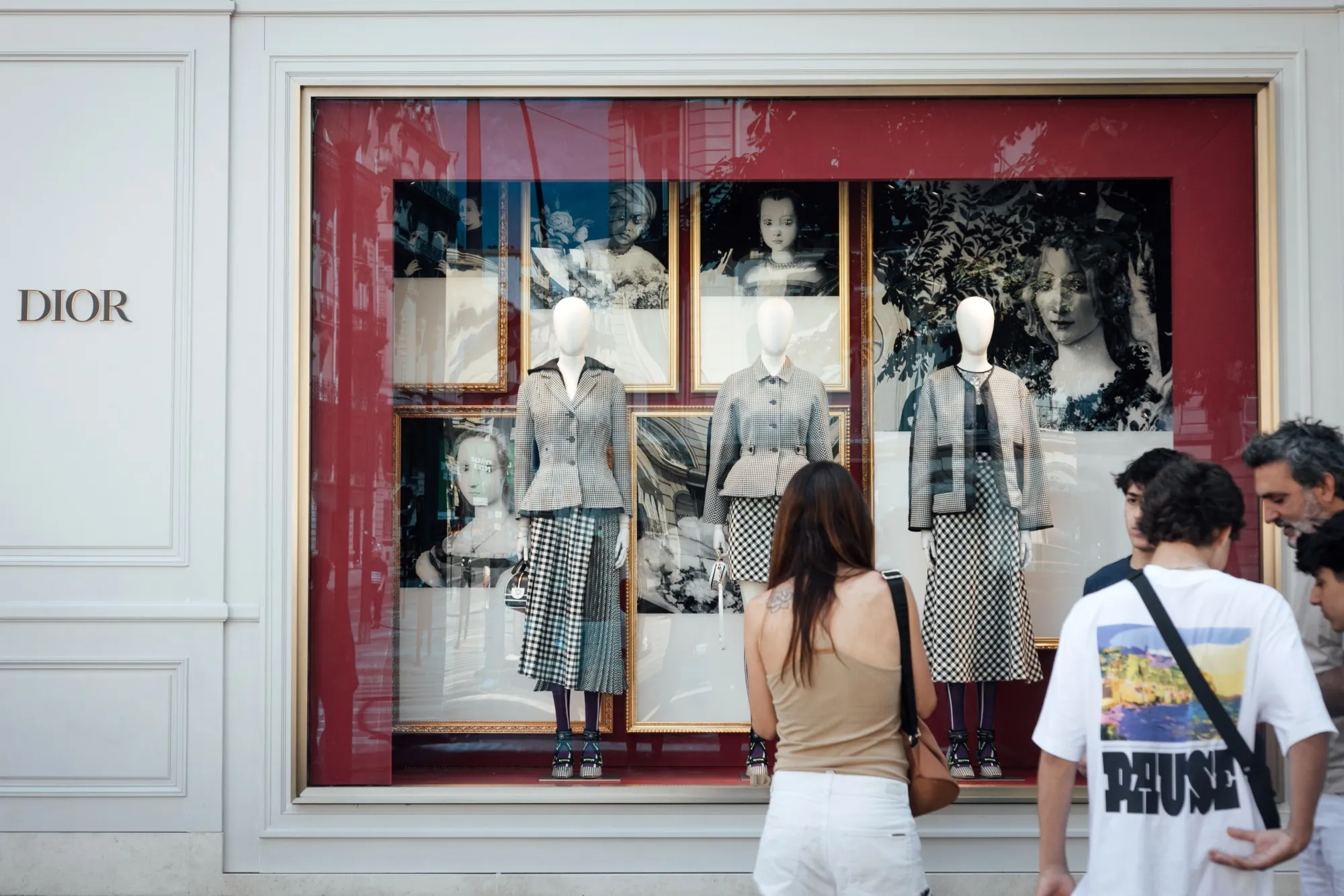 A shopper browses the window display of a Christian Dior SE luxury store&nbsp;in Paris.&nbsp;