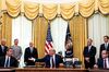 Donald Trump speaks with Aleksandar Vucic, left, and Avdullah Hoti, in the Oval Office on Sept. 4.