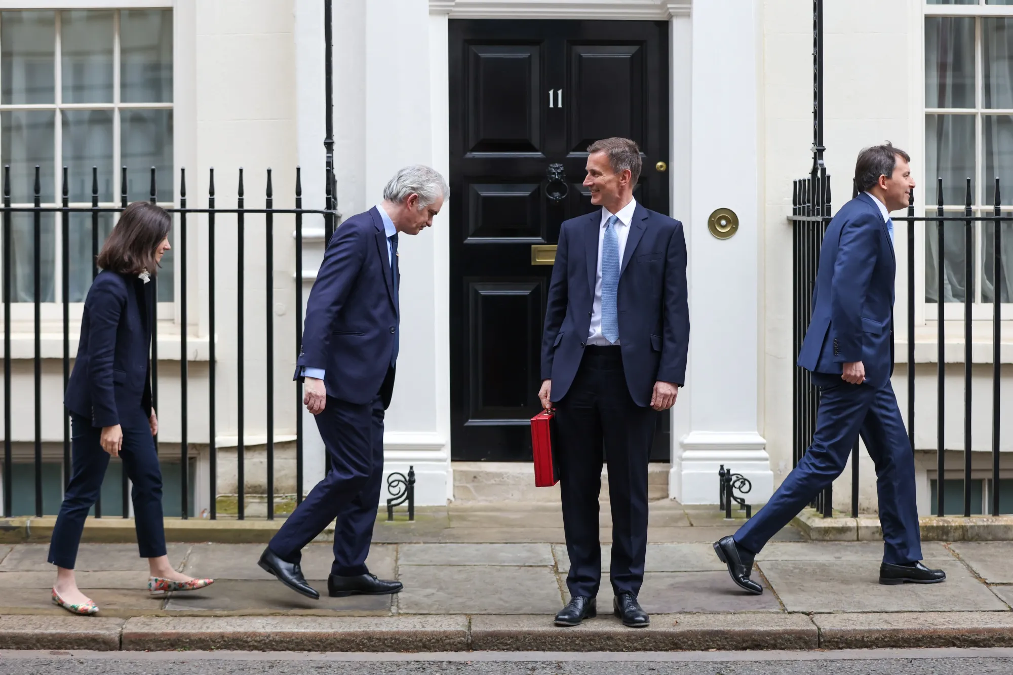 Jeremy Hunt holding the despatch box outside 11 Downing Street in London.