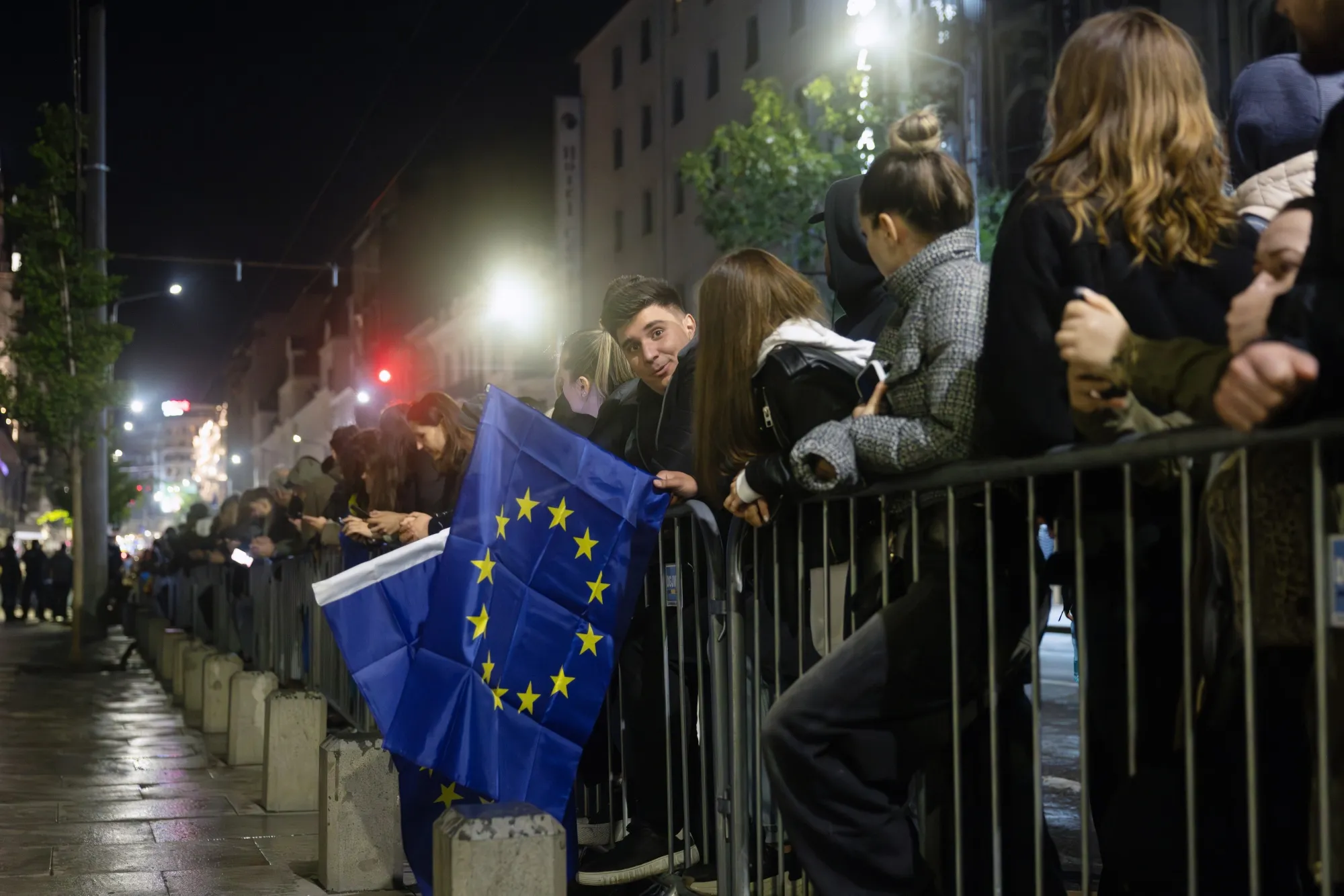Supporters hold European flags outside Nicusor Dan’s campaign headquarters on May 18.