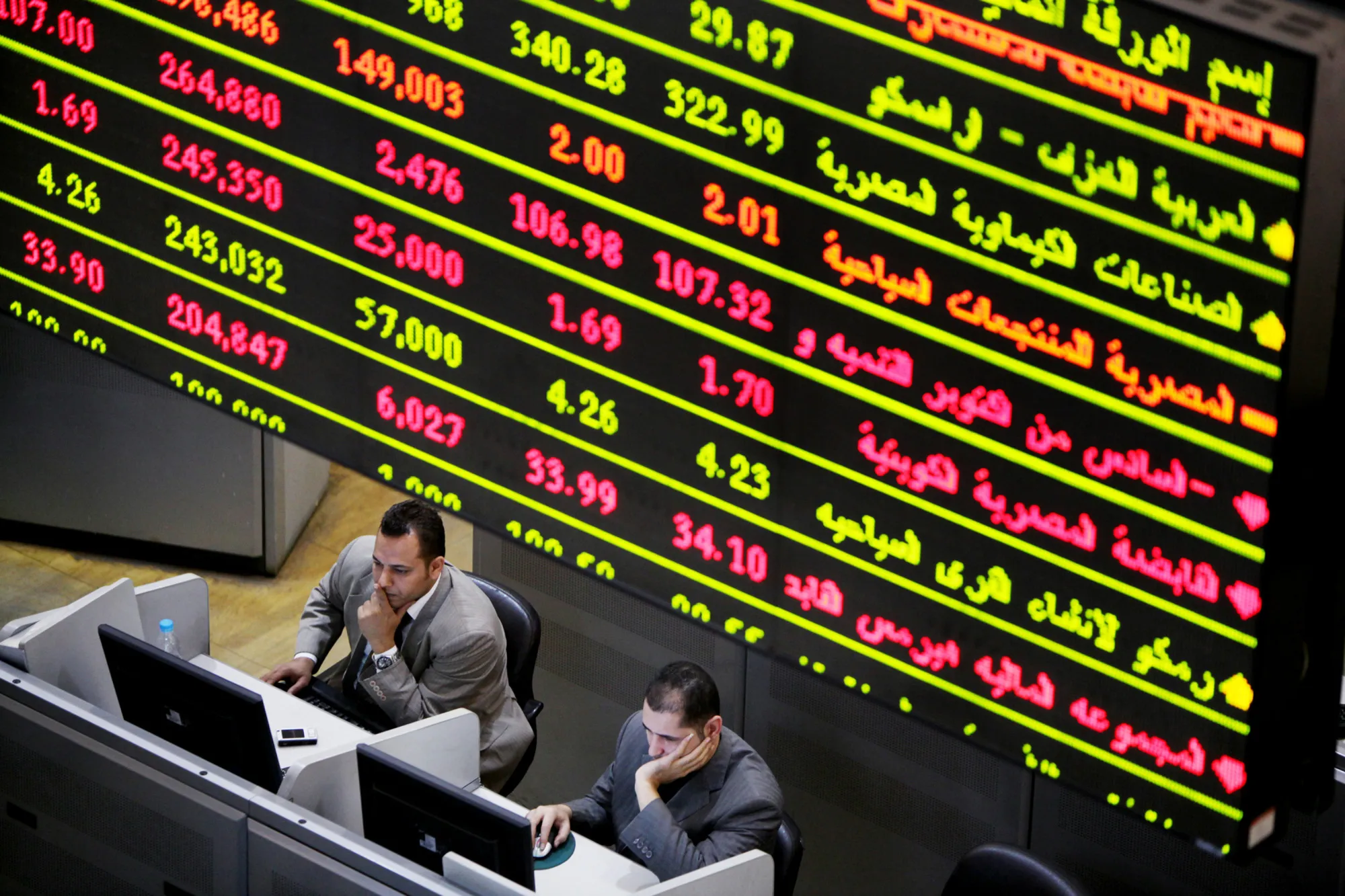 Traders work in the trading hall of the Egyptian stock exchange in Cairo, Egypt.