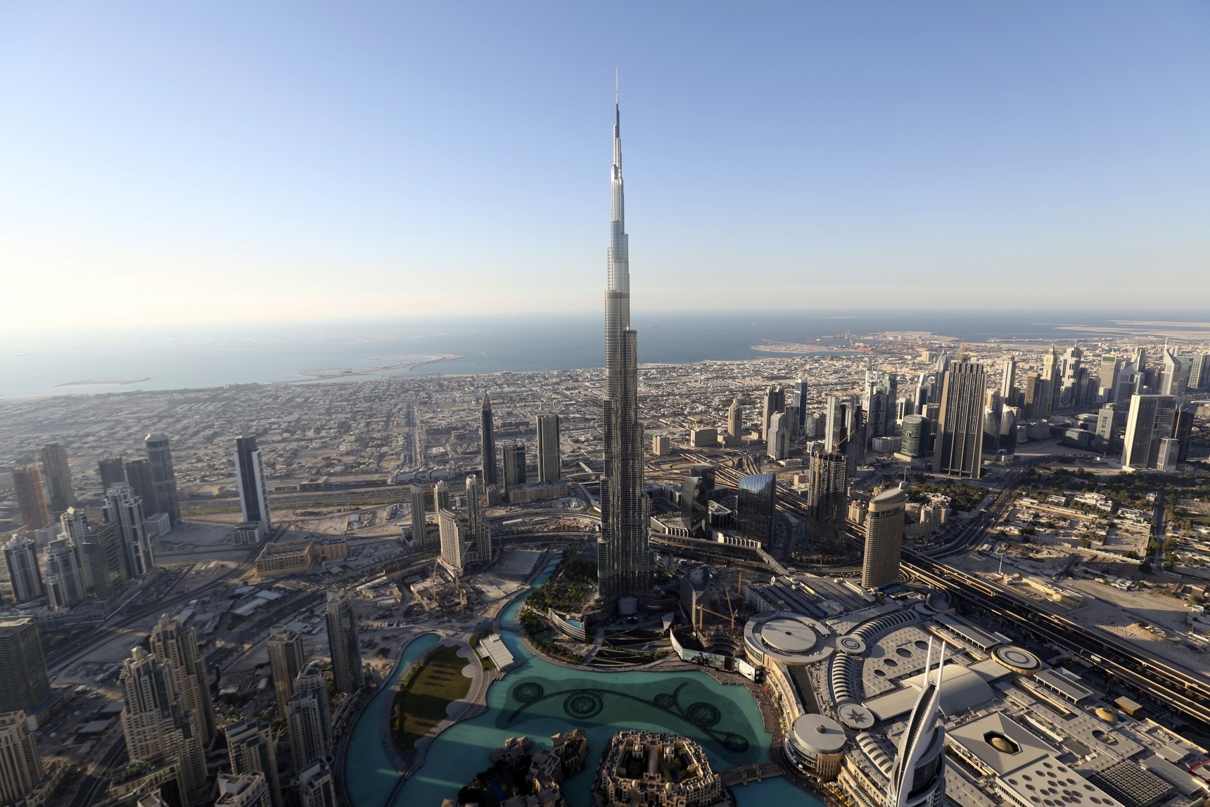 The Burj Khalifa tower, center, stands surrounded by other skyscrapers in this aerial view of the city skyline in Dubai.