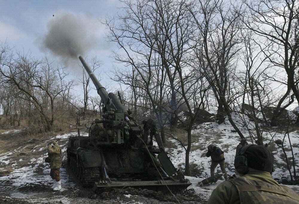 Ukrainian servicemen fire a 2S7 Pion self-propelled cannon toward Russian positions in the Donetsk region, on Feb. 22.