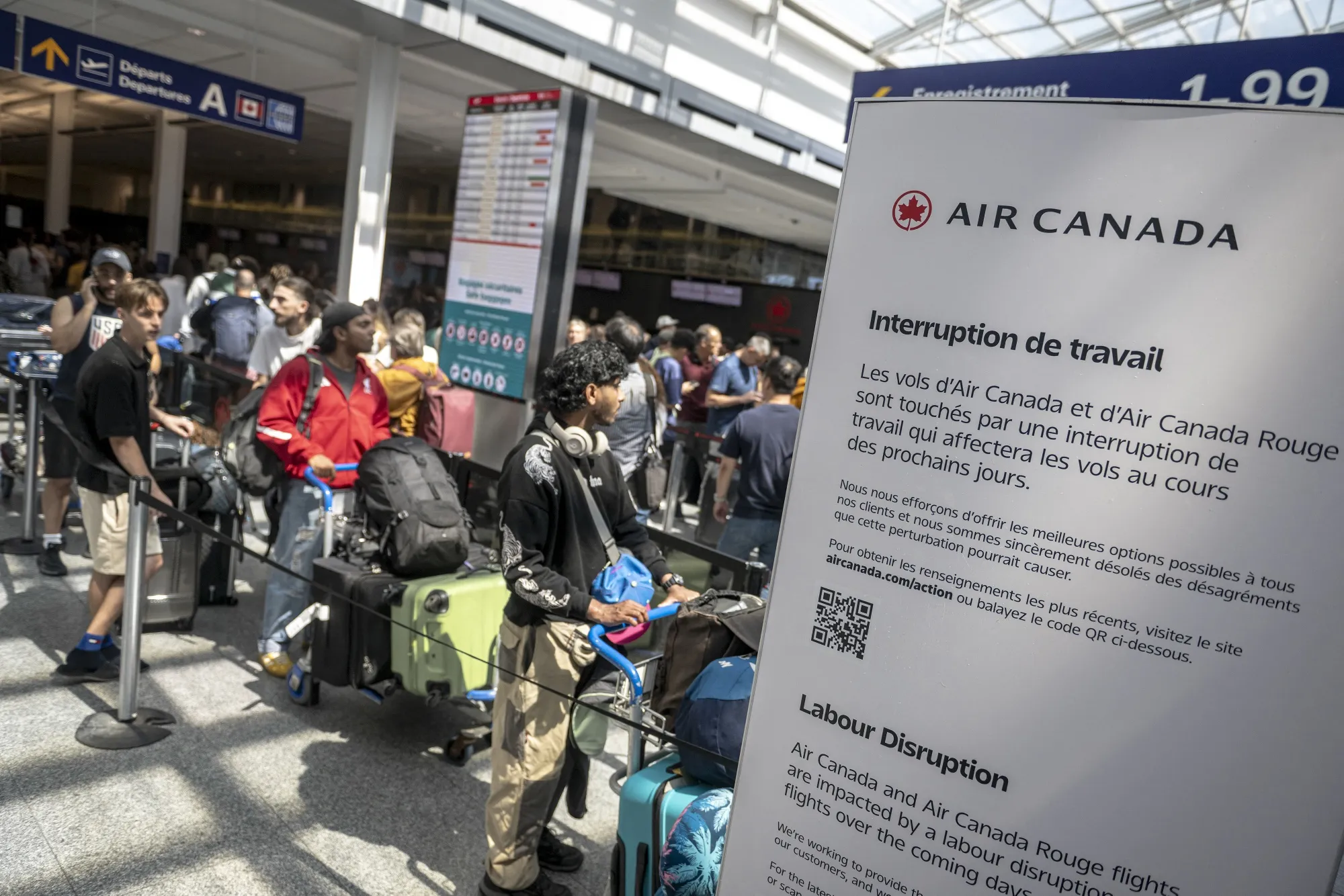 Passengers for Air Canada at the Pierre-Elliot Trudeau Airport in Montreal, Canada, on Aug. 15.