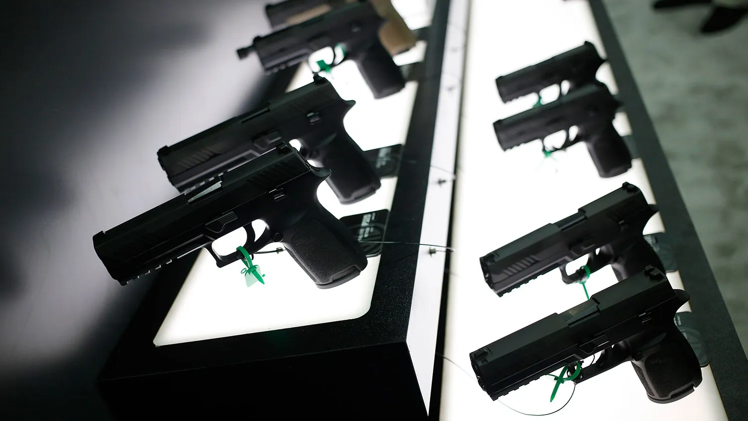 SIG P320 handguns are displayed at the SIG Sauer GmbH booth on the exhibit floor during the National Rifle Association (NRA) annual meeting in Louisville, Kentucky, on May 20, 2016.
