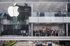 Customers browse inside an Apple Inc. store at Two International Financial Center (IFC) in Hong Kong, China.