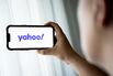 In this photo illustration, the Yahoo logo seen displayed on