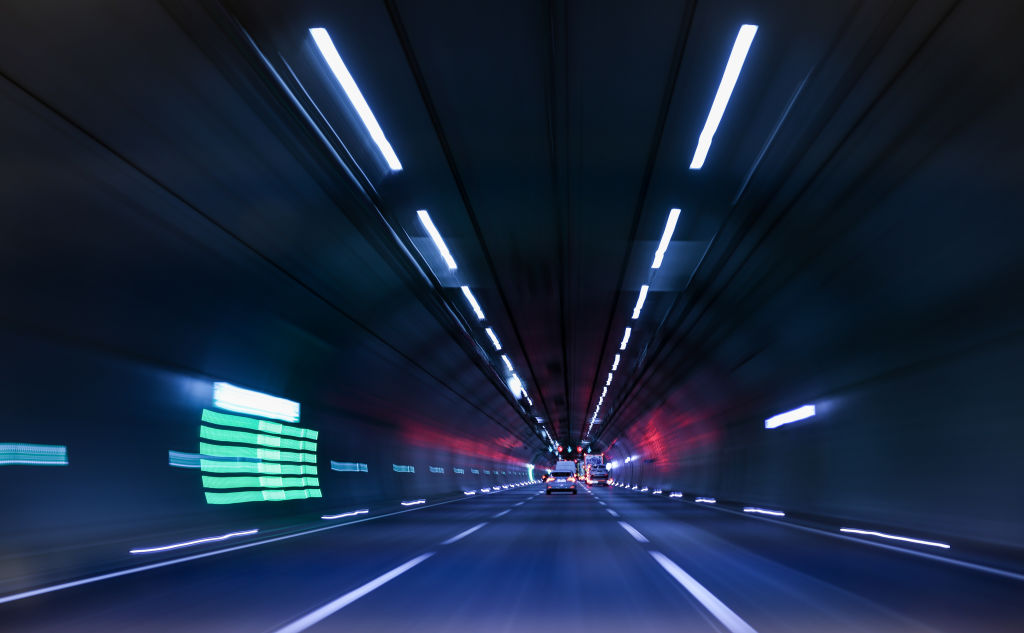 29 May 2024, Thuringia, Jena: Cars and trucks drive through the Jagdberg Tunnel on the Autobahn 4 near Jena. The tunnel, which is a good 3 kilometers long, was built between 2008 and 2014. It replaces the winding and steep route through the Leutra valley. Photo: Jan Woitas/dpa (Photo by Jan Woitas/picture alliance via Getty Images)