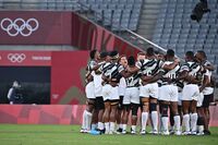 Fiji's players celebrate winning the men's final rugby sevens match between New Zealand and Fiji during the Tokyo 2020 Olympic Games at the Tokyo Stadium in Tokyo, on July 28.