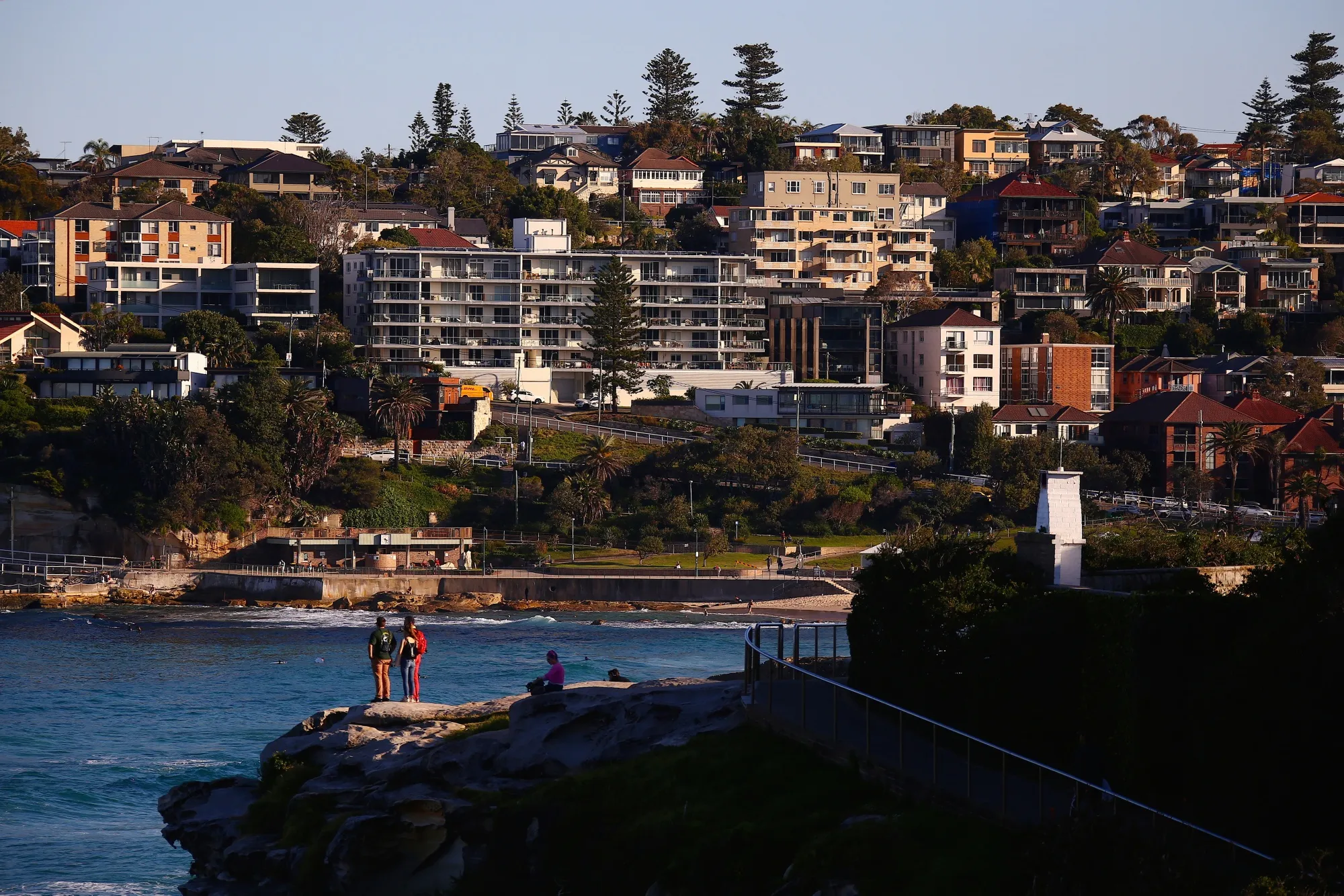 Residential buildings stand along the coastline near Bondi Beach in Sydney, Australia.