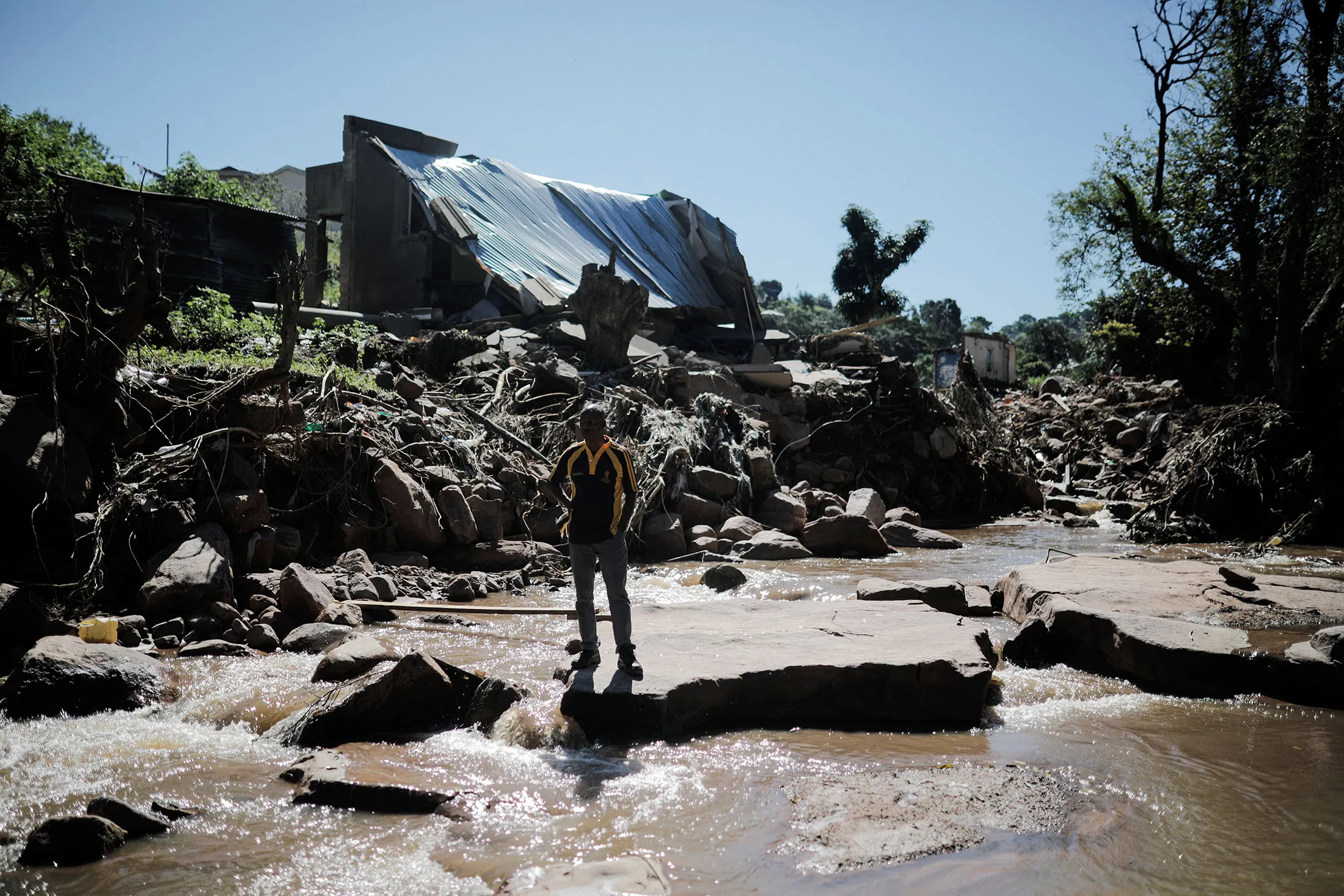 A resident surveys flood damage&nbsp;in KwaNdengezi, west of Durban, South Africa, on April 20.