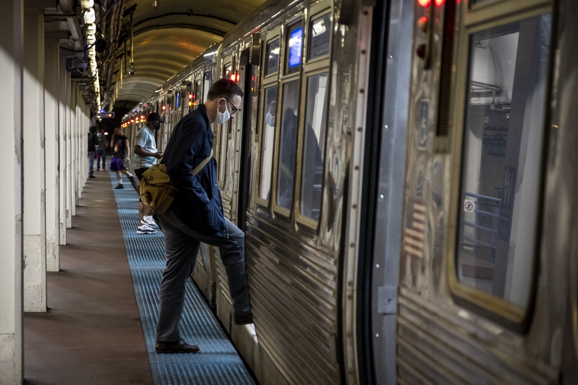 A commuter boards a Chicago Transit Authority train on June 3.