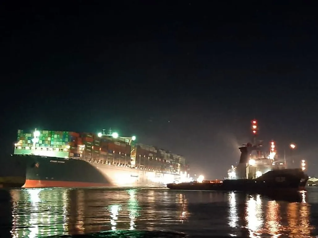 The Ever Given during attempts to re-float the vessel in the Suez Canal early Monday.