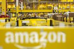 The Amazon logo sits on a cart parked in the inbound goods zone at the Amazon.com Inc. fulfillment center in Poznan, Poland, on Friday, June 12, 2015. Amazon is the largest distributor of e-books in Europe, where the product's popularity has experienced a surge in recent years.