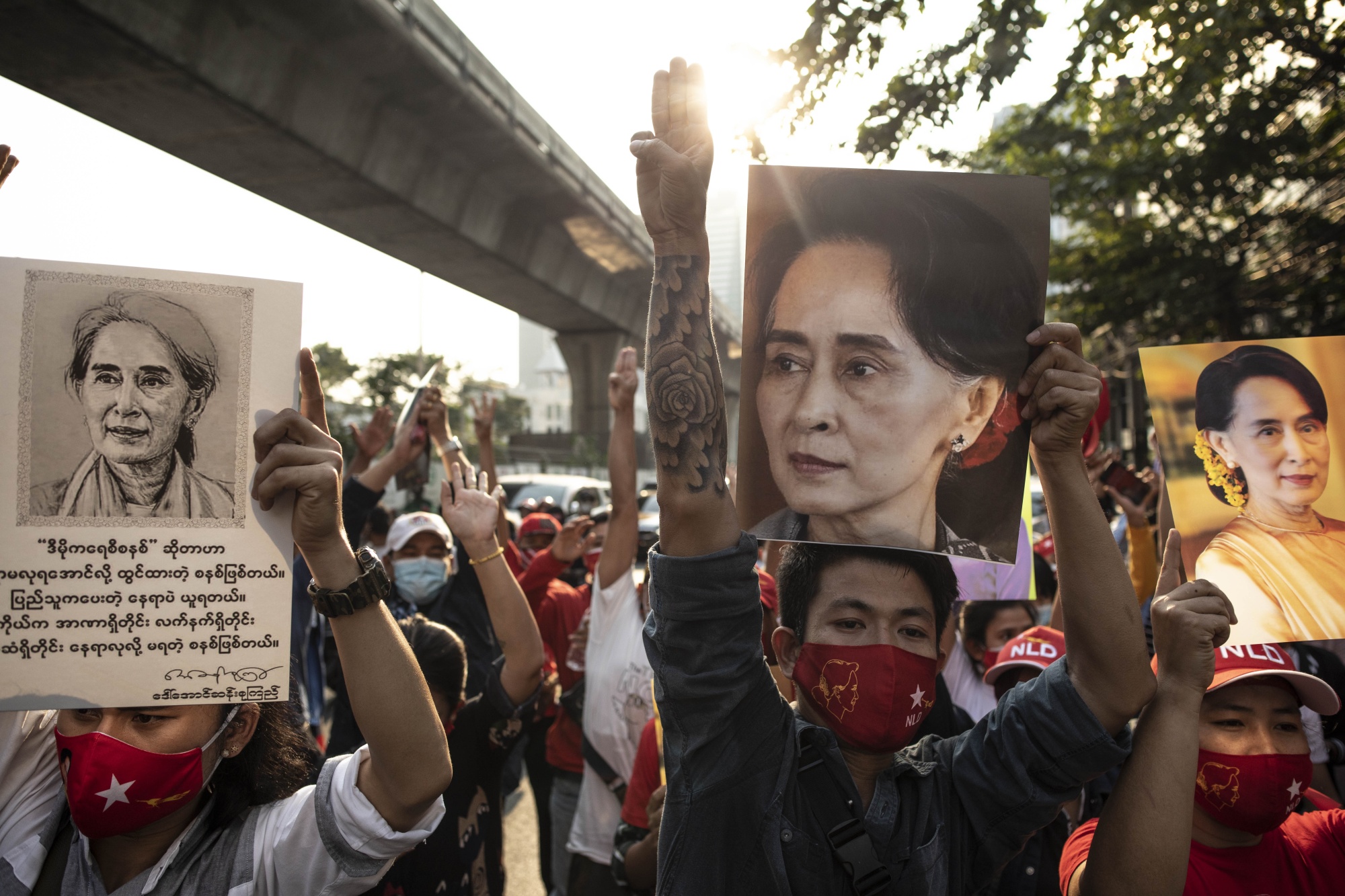Demonstrators hold up images of Aung San Suu Kyi outside the Embassy of Myanmar in Bangkok&nbsp;on&nbsp;Feb. 1.&nbsp;