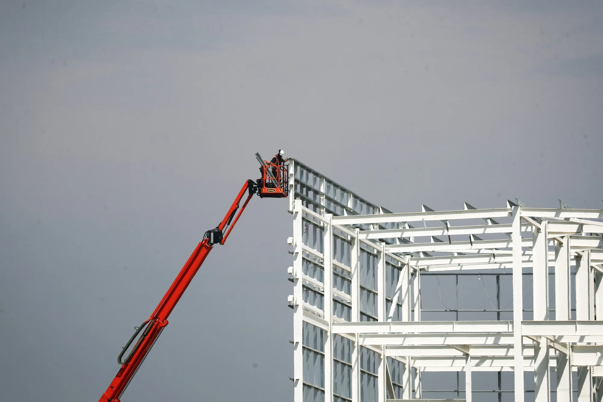 Work is carried out on the frame of the Amazon.com Inc. warehouse in Dartford, U.K., on Aug. 11. The project will be the largest warehouse in Europe.