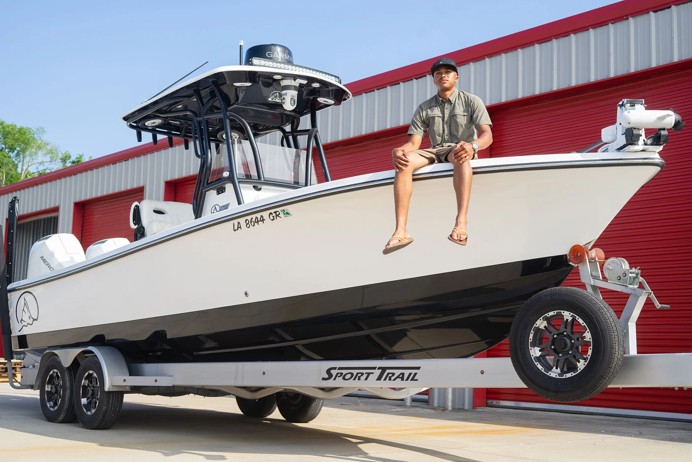 Fisherman Khristian Rousseve with his boat in Addis, Louisiana.