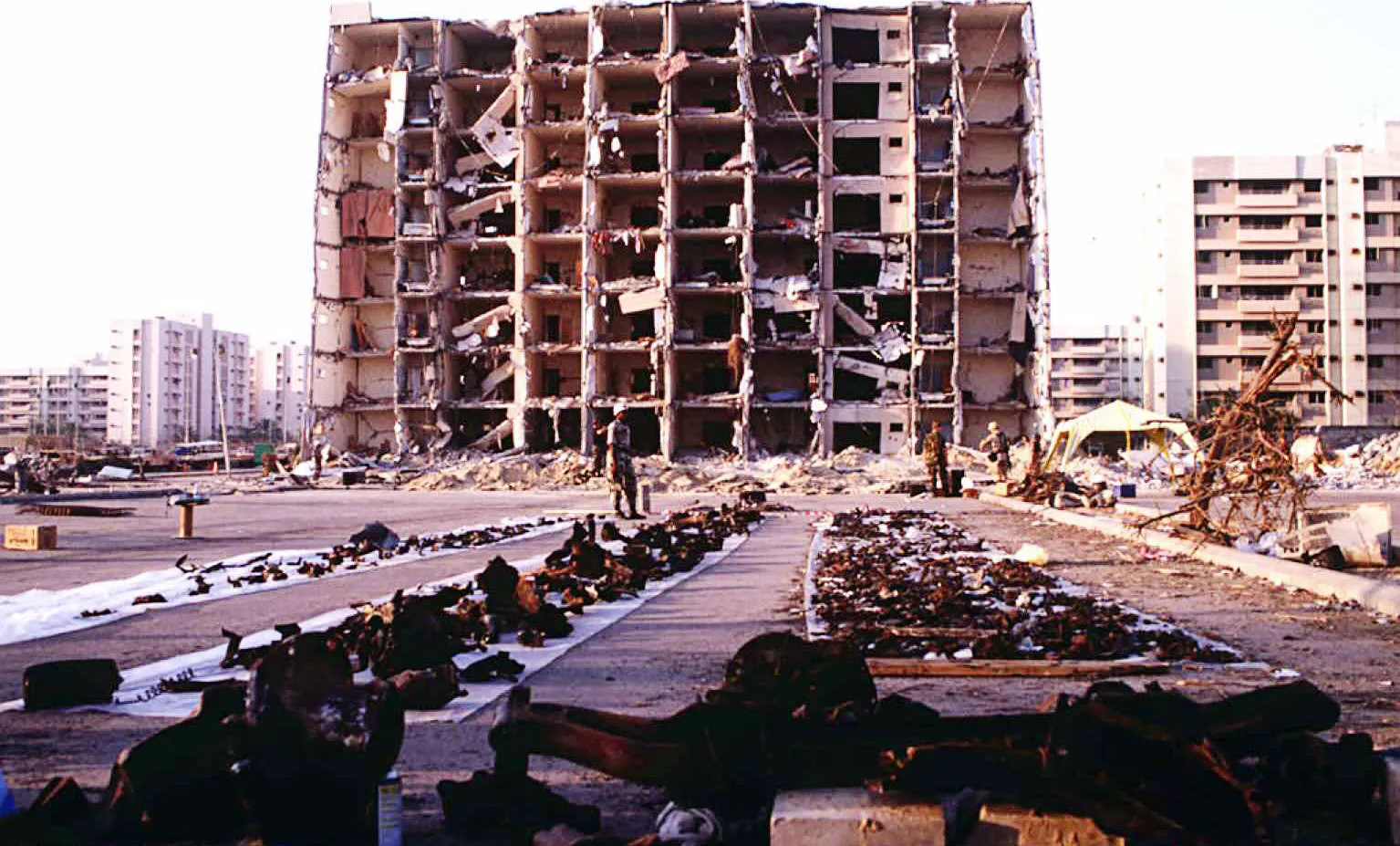U.S. and Saudi officials gather evidence following the bombing of the Khobar Towers complex in Dhahran, Saudi Arabia.
