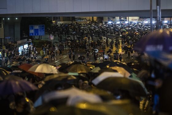 Hong Kong Protest Tactics Shift With Peaceful Mass March in Rain