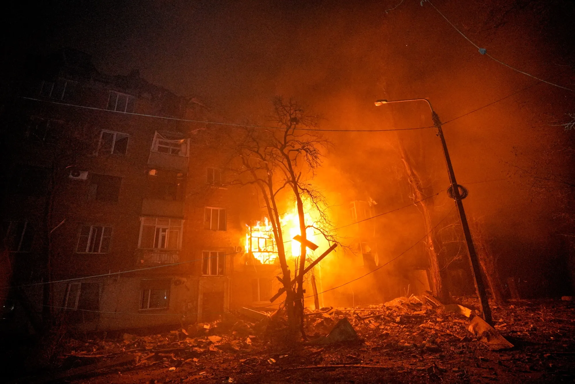 A residential building burns following a Russian attack in Kryvyi Rih, Ukraine, on Jan. 8.