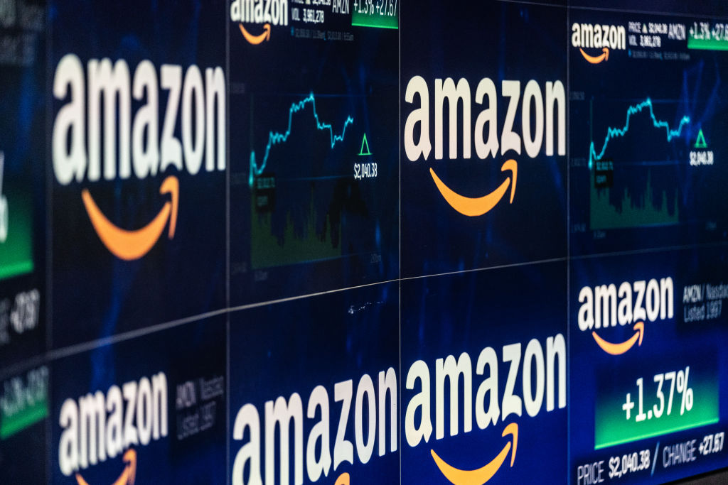 A monitor displays Amazon.com Inc. stock information at the Nasdaq MarketSite in New York, U.S., on Tuesday, Sep. 4, 2018. Amazon.com Inc. briefly became America's second trillion-dollar company on Tuesday after adding $434 billion to its market cap this year.