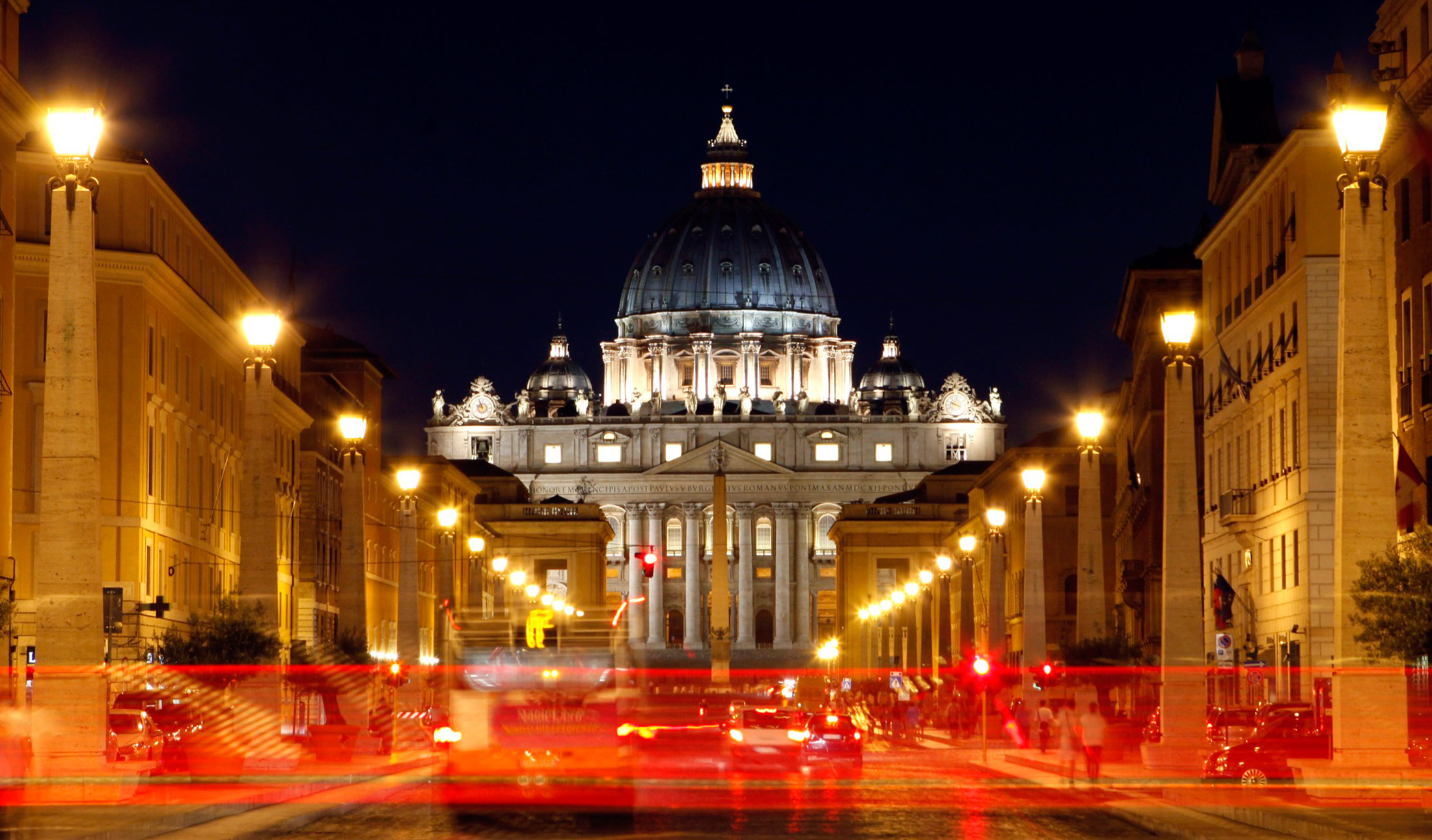 St. Peter's Basilica stands on the horizon in Rome.
