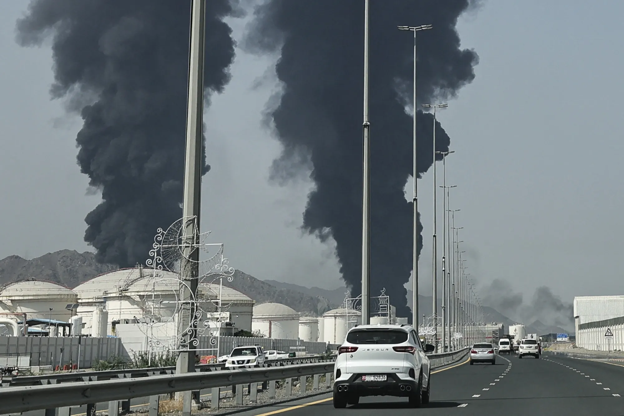 Smoke rises from the direction of Fujairah, UAE, on March 14.