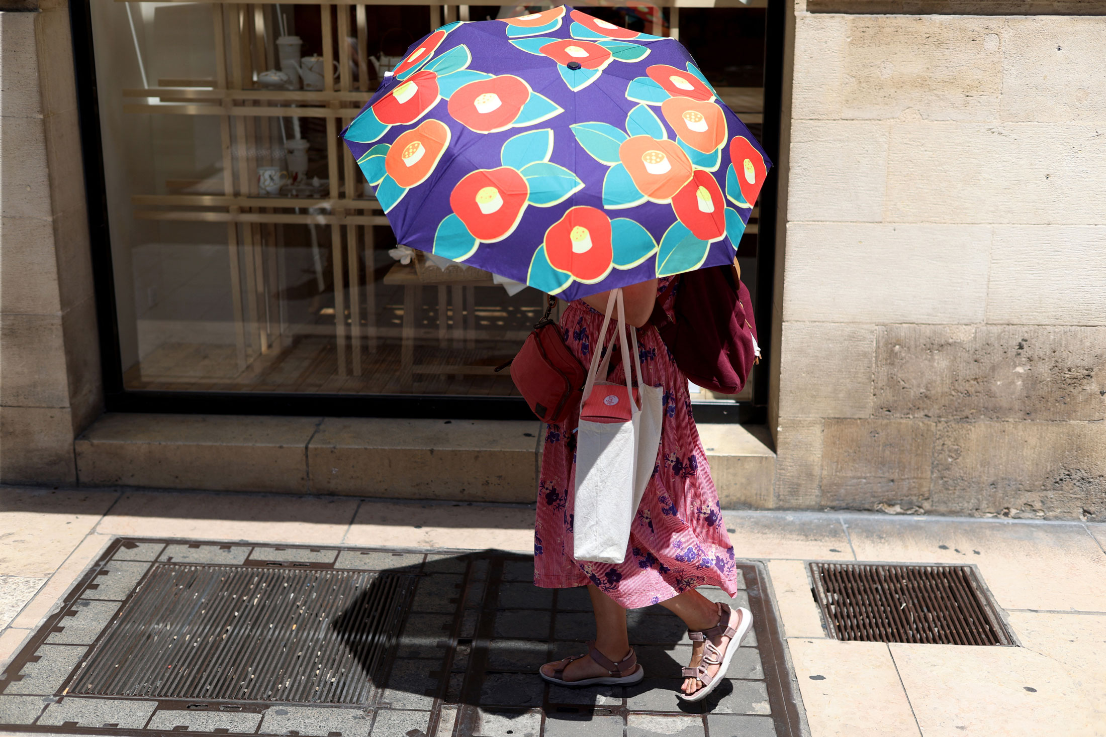 A woman shelters from the sun in Bordeaux, south-western France, on June 17. Photographer: Romain Perrocheau/AFP/Getty Images