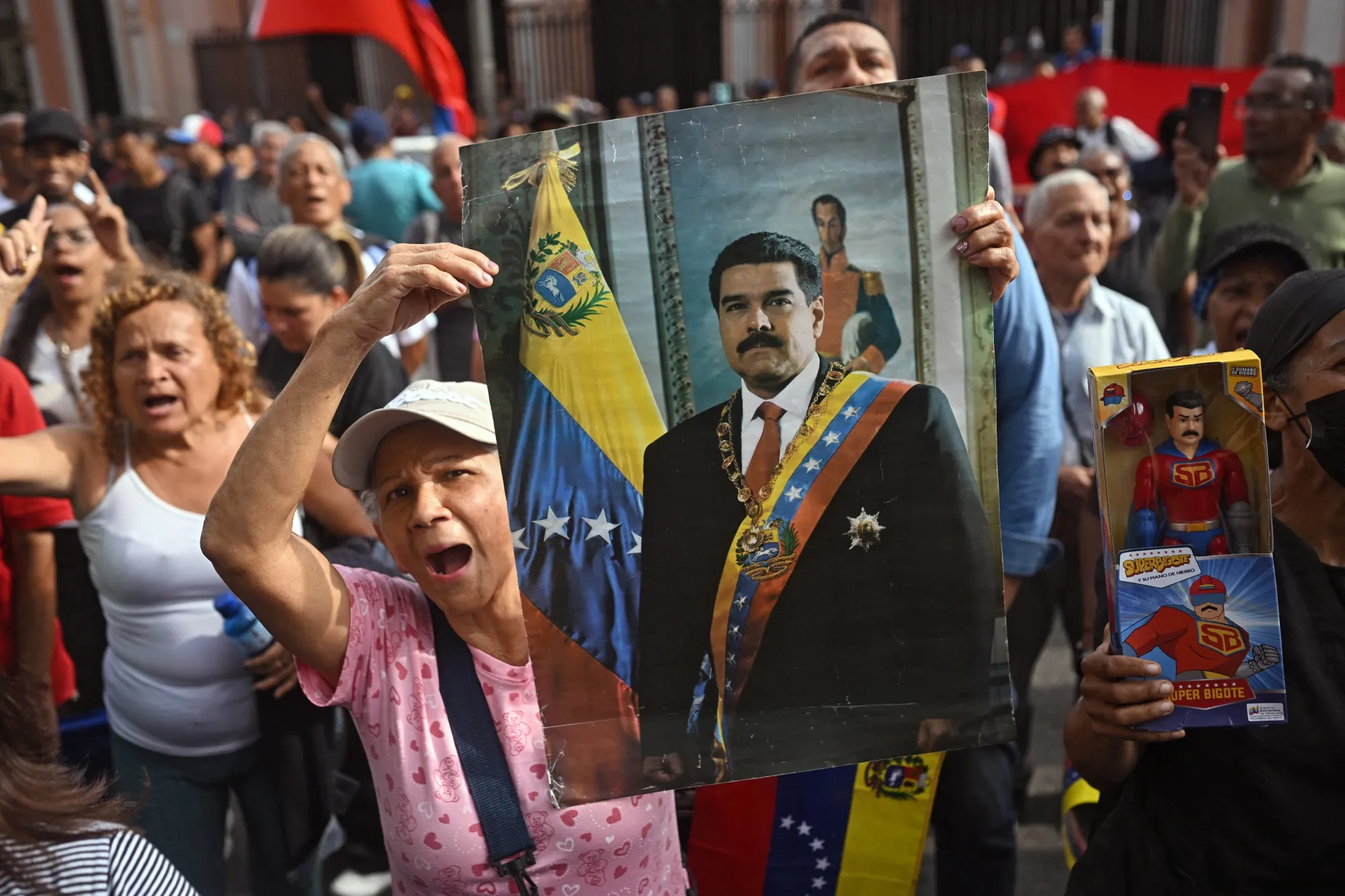 A woman holds a portrait of Nicolás Maduro in Caracas on Jan. 3.