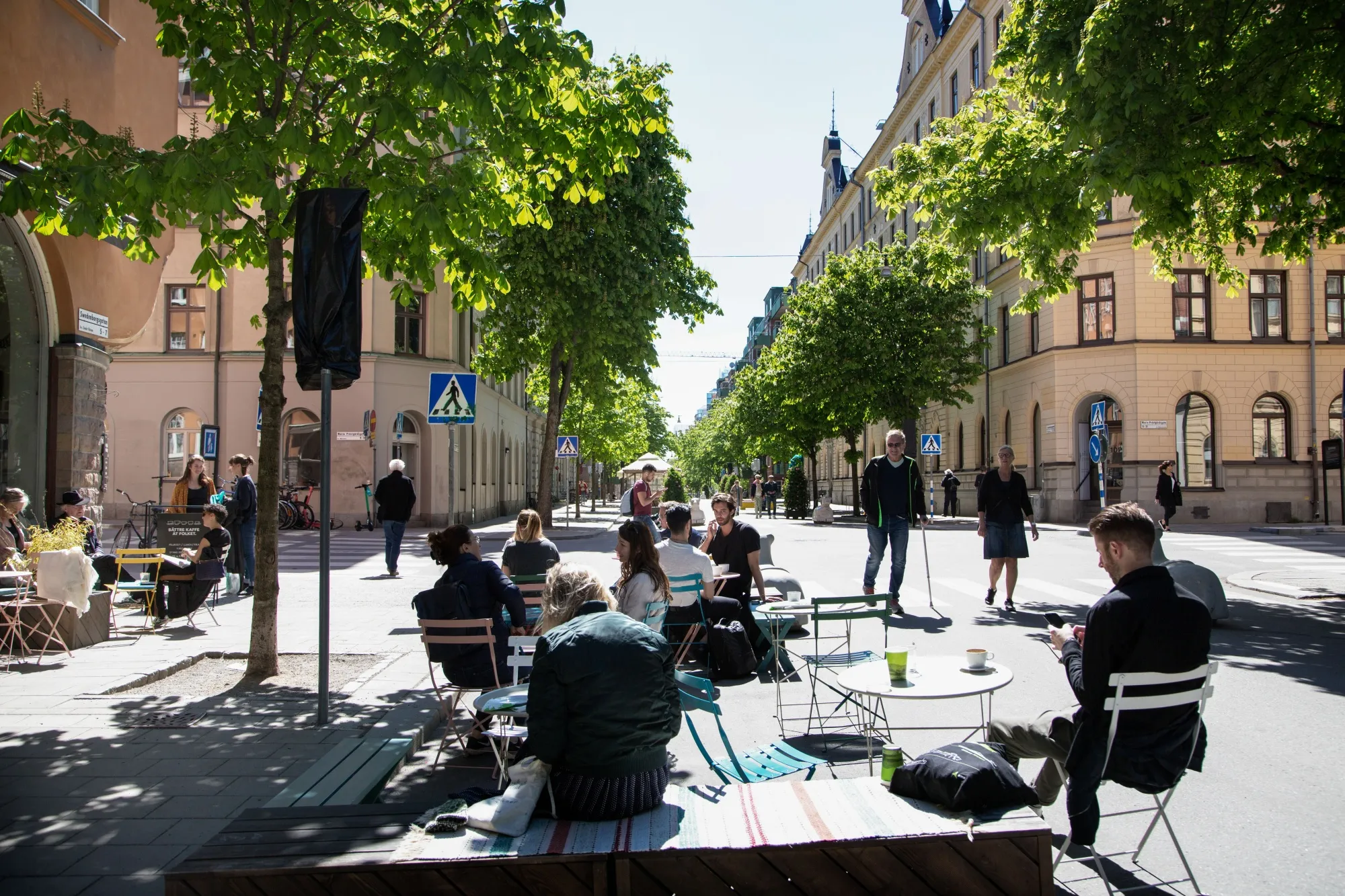 Customers sit at terrace tables outside a cafe in Stockholm, on May 22.