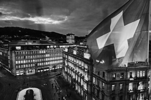 The Swiss flag flies on the roof of luxury hotel Savoy Baur en Ville, overlooking Paradeplatz.