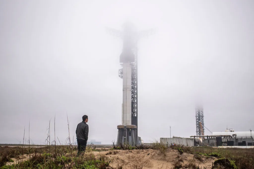 A visitor looks at the launch site of the SpaceX Starship rocket near Boca Chica, Texas.