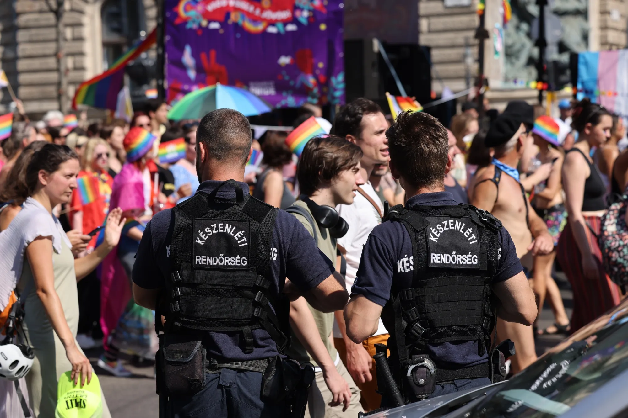 Police officers watch the crowd during the Pride parade in Budapest, in 2023.
