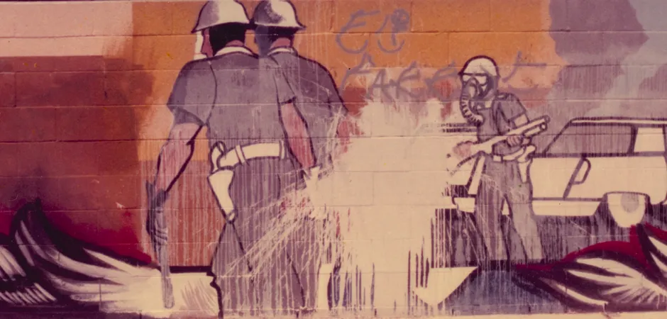 A mural in Fountain Valley, by Sergio O’Cadiz. Shortly after it was painted in 1976 it was attacked with white paint to cover the image of two policemen dragging a Latino.