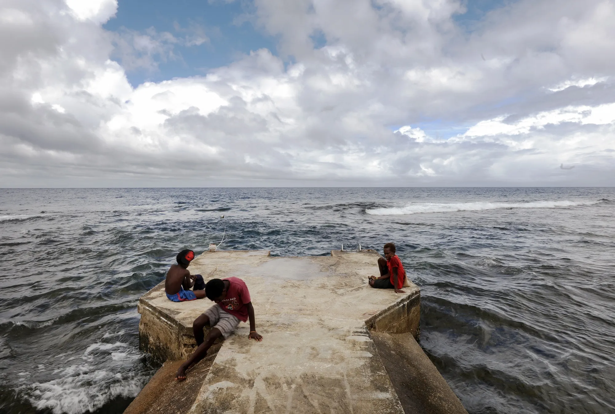 People gather on a pier&nbsp;in Tanna, Vanuatu in December 2019.