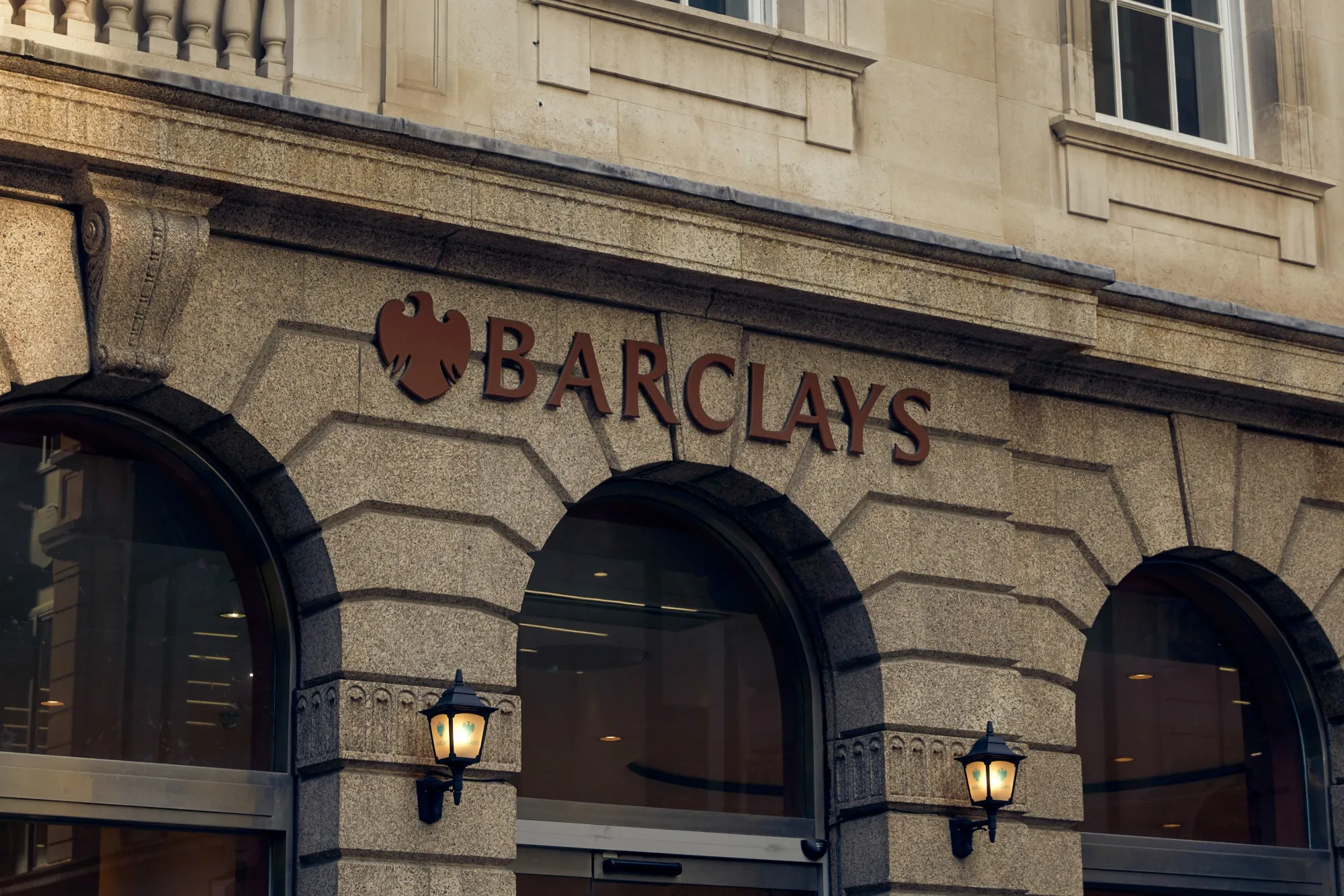 A sign hangs above an entrance to a branch of Barclays Plc bank in the City of London, U.K., on Tuesday, June 23, 2020. Many of the financial district’s most venerable names were built off colonial oppression.