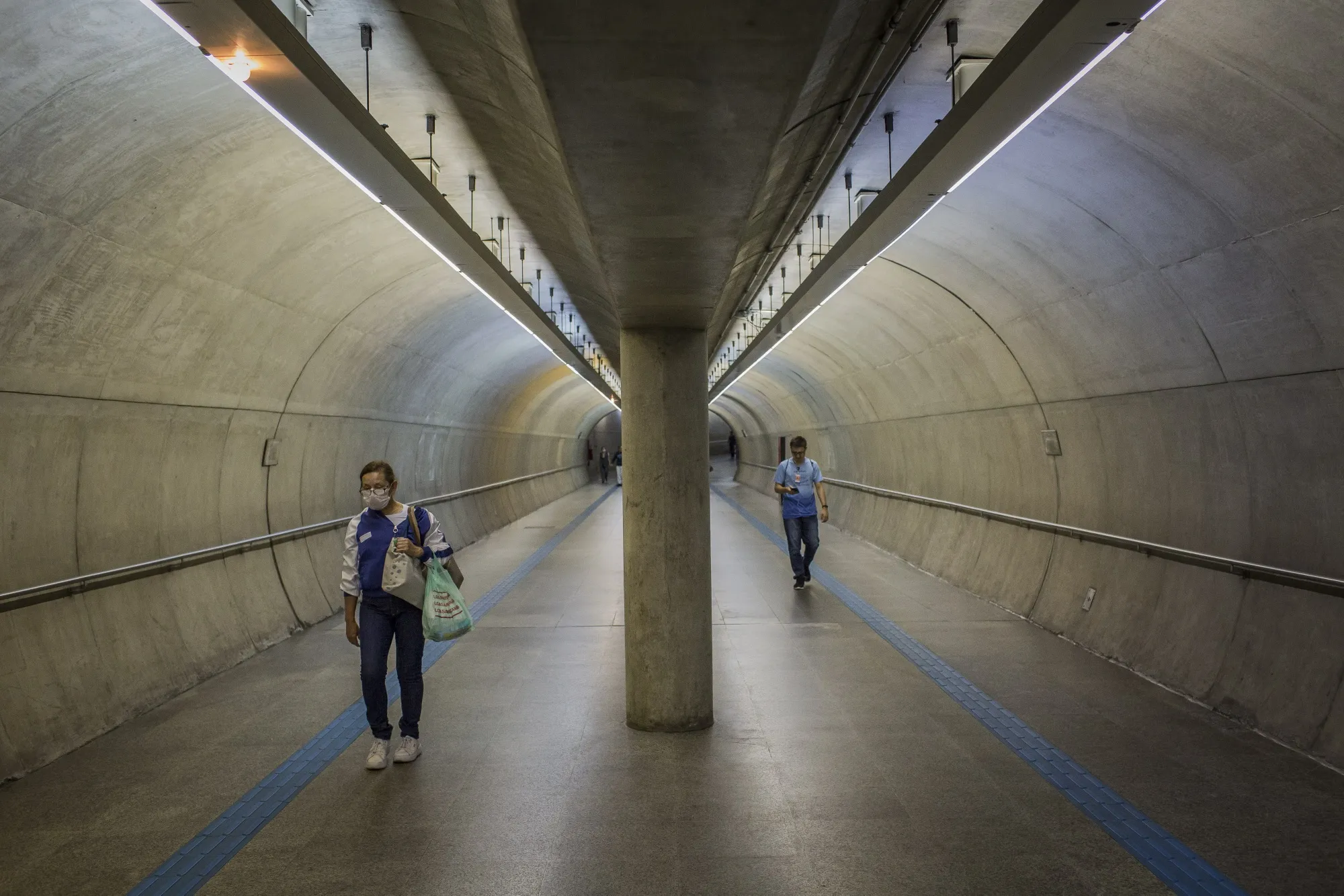Pedestrians walk through the Clinicas train station in Sao Paulo on March 25.