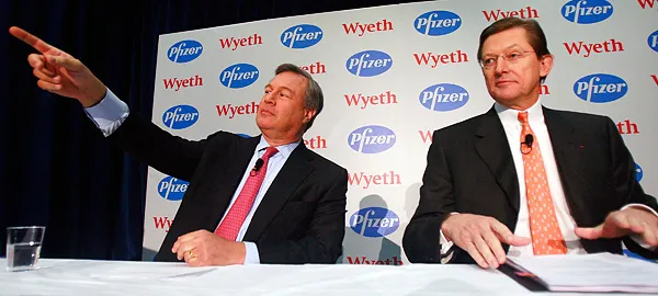 Jeffrey B. Kindler, CEO of Pfizer (L) and Bernard Poussot, CEO of Wyeth 