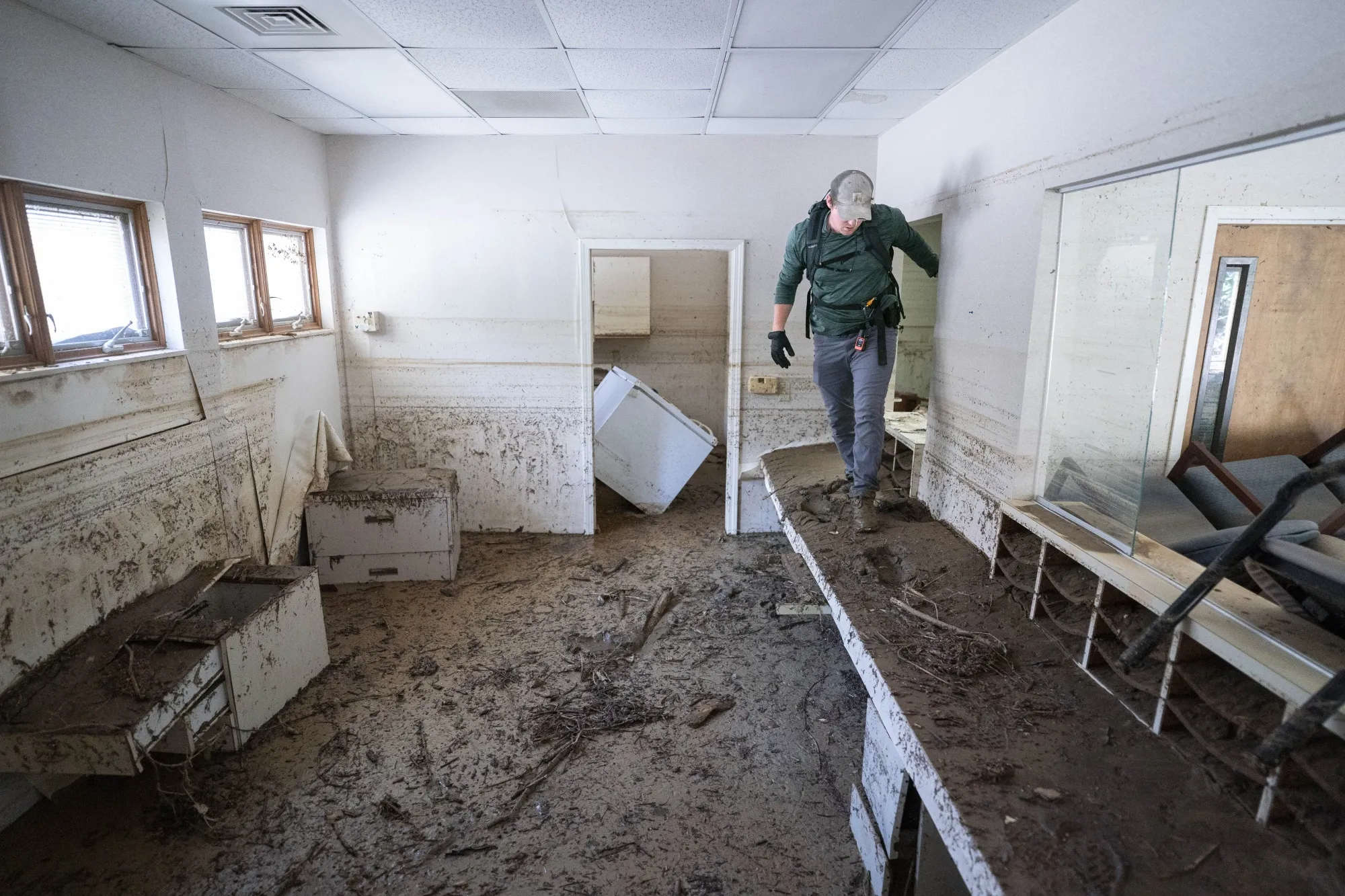A search and rescue team member inspects a building in the aftermath of Hurricane Helene&nbsp;in Bat Cave, North Carolina,&nbsp;on Oct. 1.