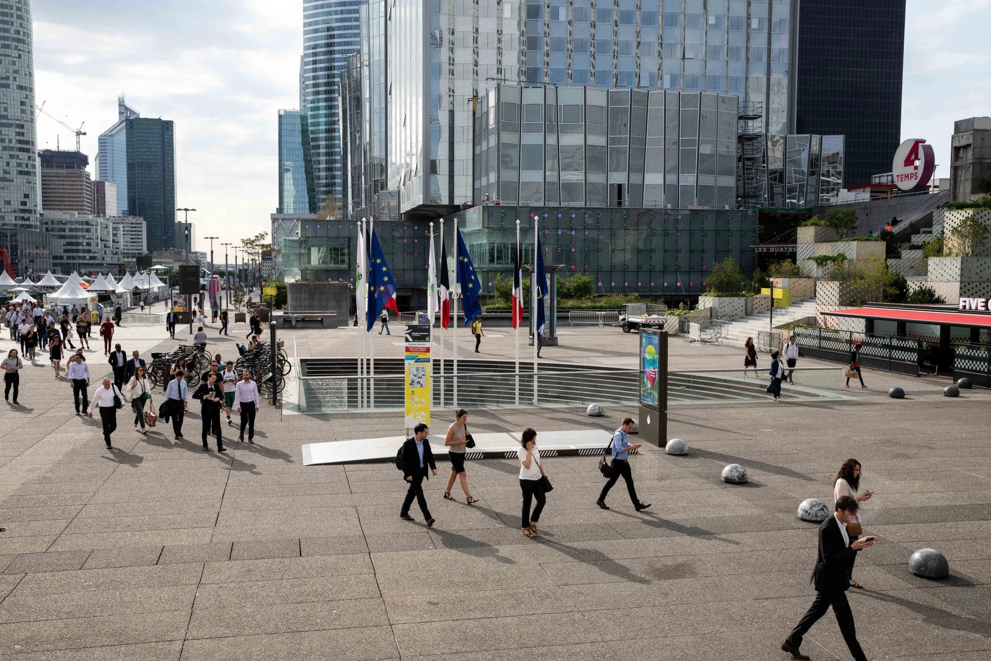 City workers arrive in La Defense business district of Paris.
