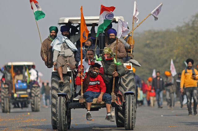Farmers protest during a tractor rally near the Singhu border crossing in Delhi, India, on Tuesday, Jan. 26, 2021. Thousands of Indian farmers on tractors entered New Delhi as the country marked its Republic Day, escalating protests against new agricultural laws passed by Prime Minister Narendra Modi's government.