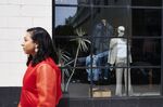 A pedestrian passes in front of a J. Crew Group Inc. store in the Brooklyn borough of New York.