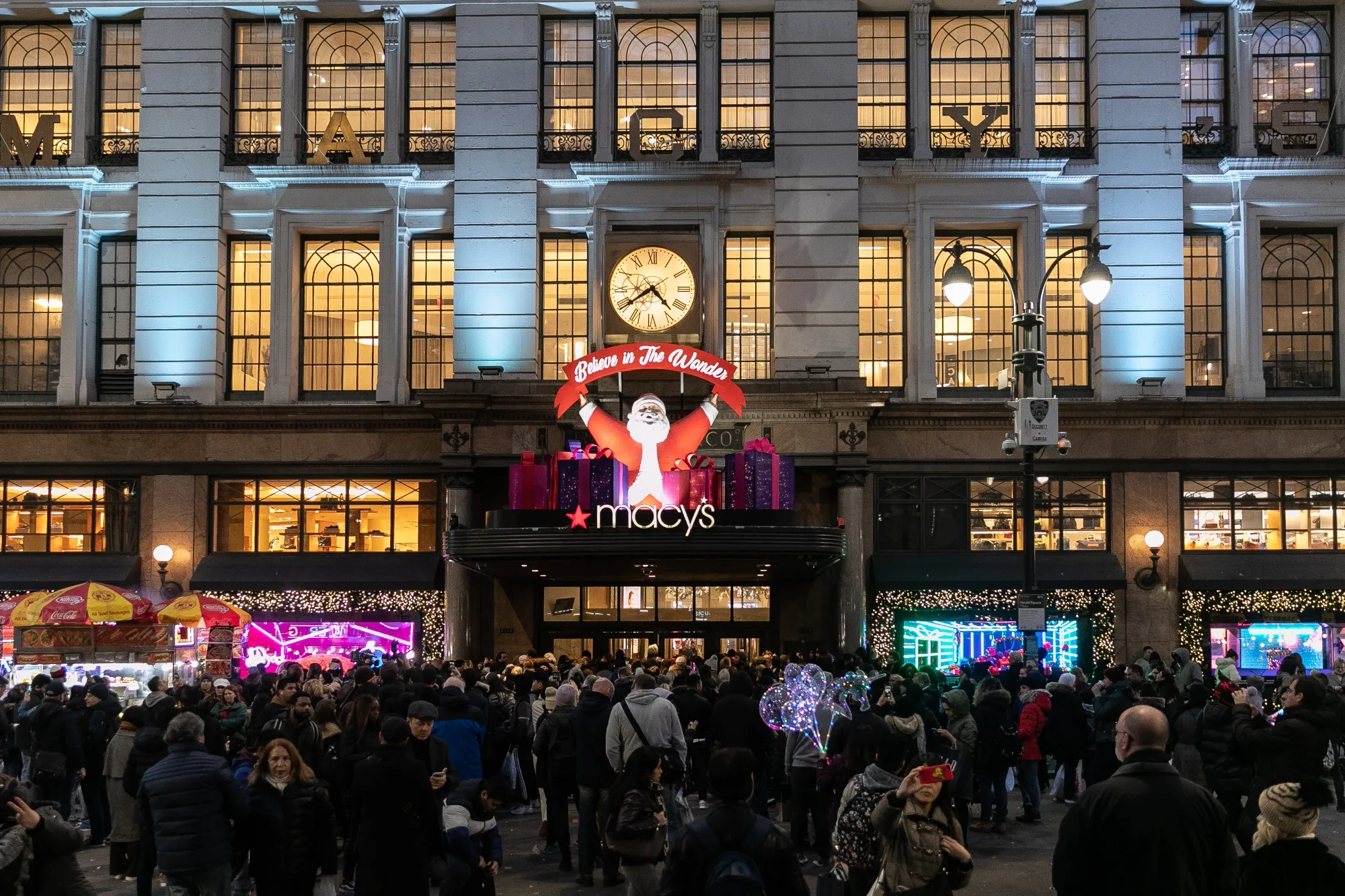 Shoppers wait outside the Macy’s Inc. flagship store in New York ahead of Black Friday.