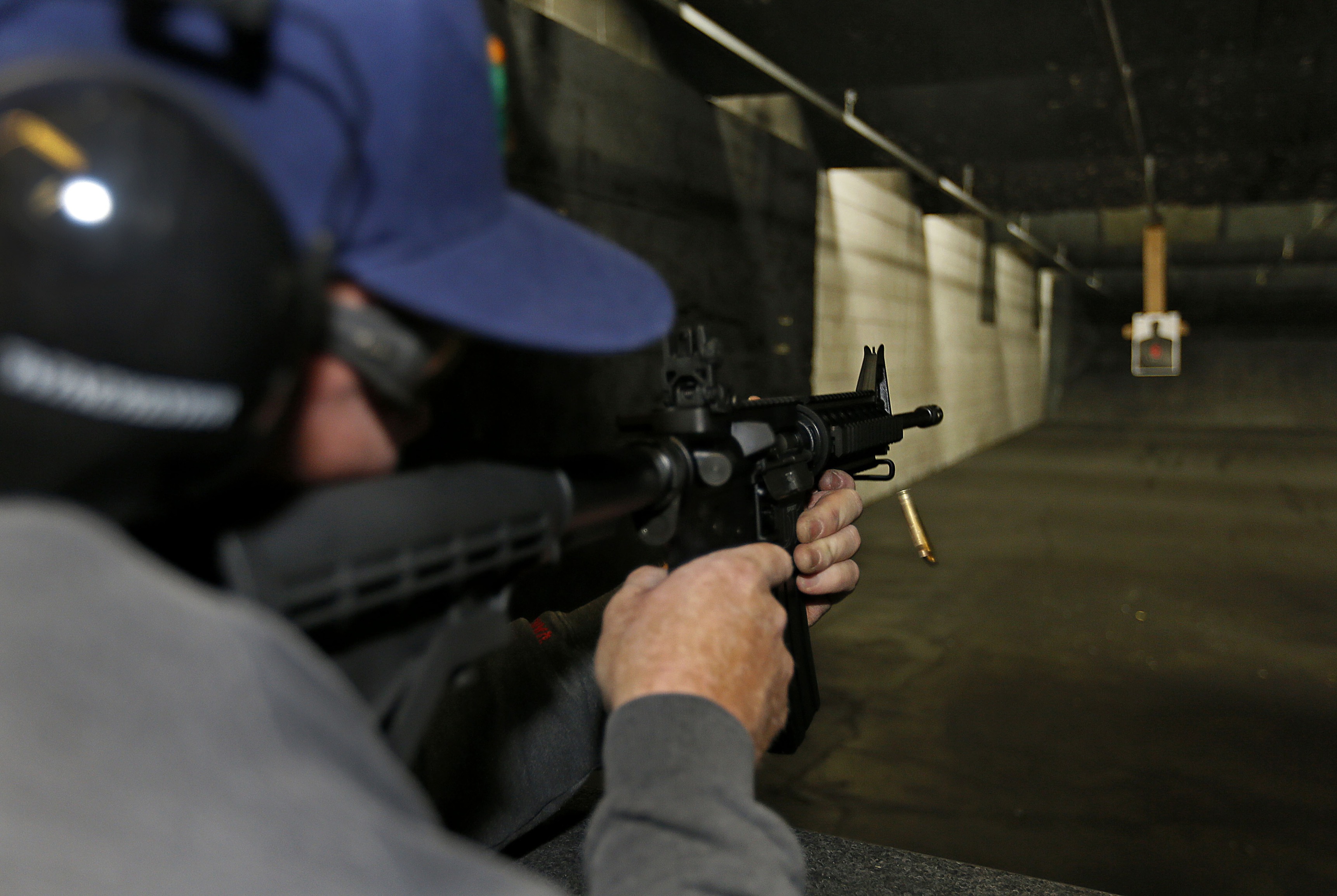 A customer fires an AR-15 rifle in Springville, Utah.