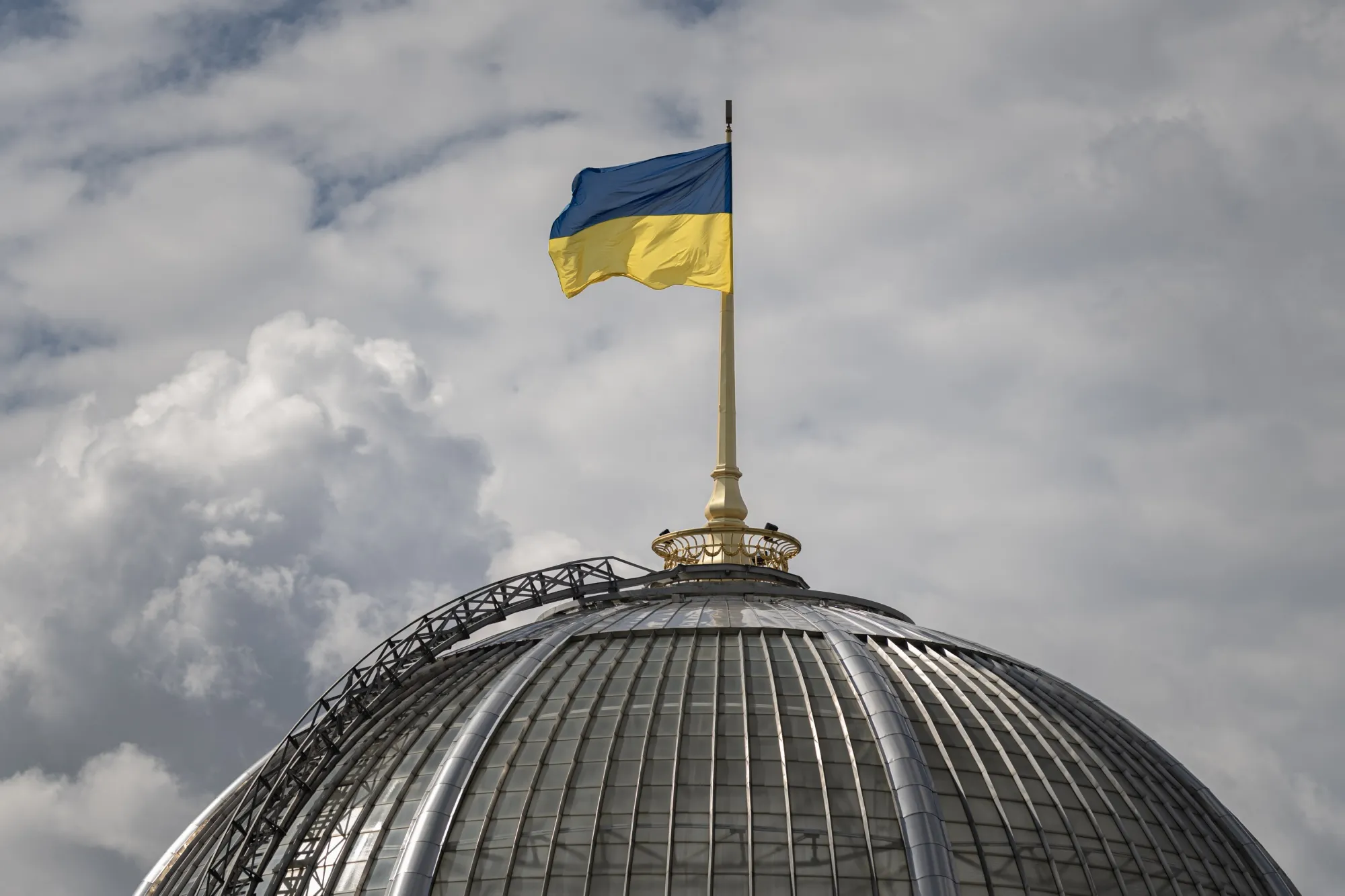 A Ukrainian national flag flies over the parliament building&nbsp;in Kyiv.