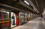 A masked rider aboard the London Underground.