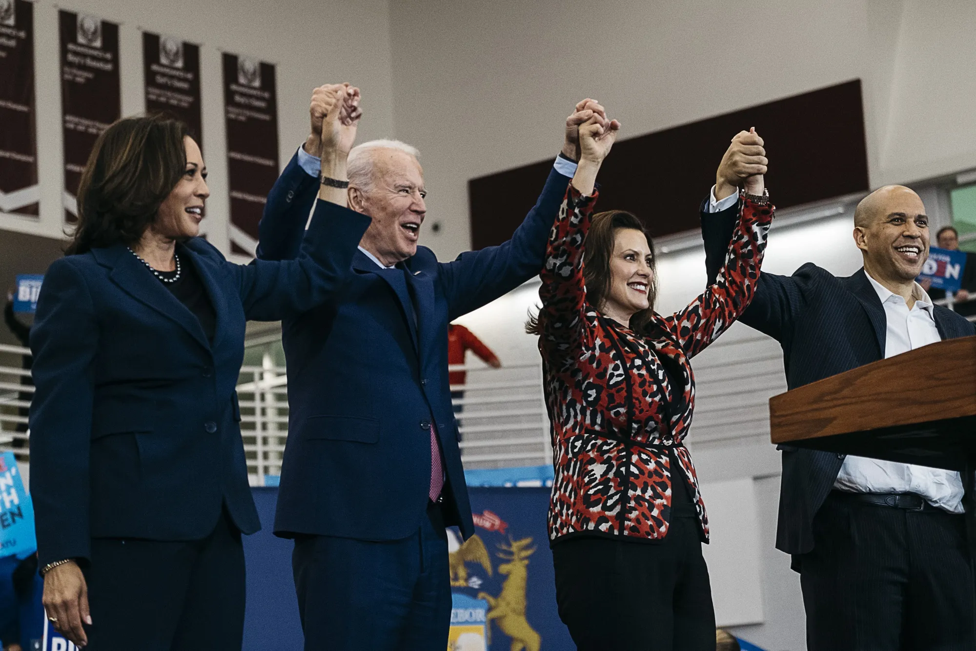 Senator Kamala Harris, Joe Biden, Gretchen Whitmer, and Senator Cory Booker hold hands during a campaign event for Biden in Detroit, on March 9.