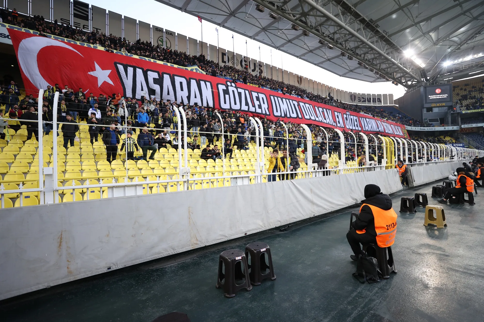 Fans open a banner addressing the earthquakes in Turkey during a match between Fenerbahce and Konyaspor&nbsp;in Istanbul on February 25.